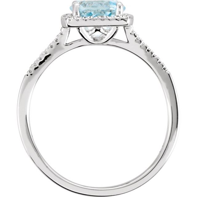Side view of natural sky blue topaz halo ring